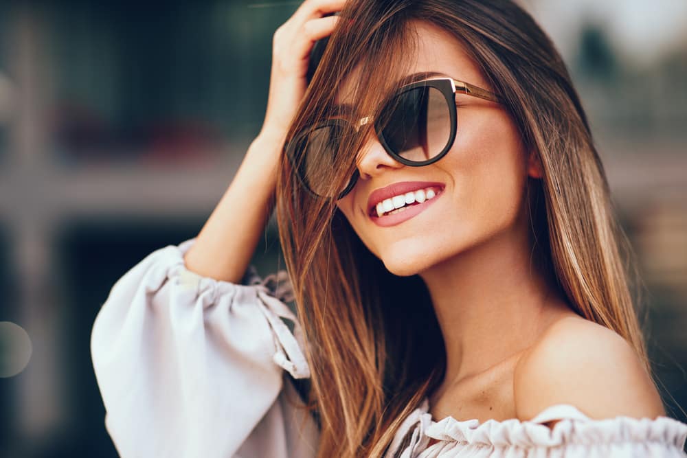 woman smile sunglasses
