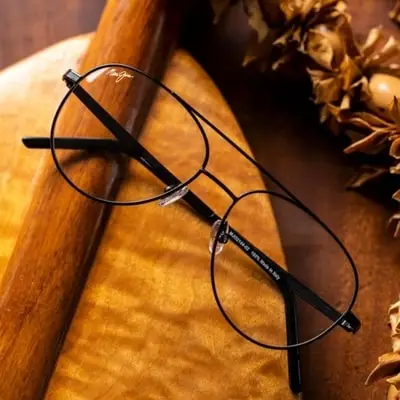 pair-of-stylish-maui-jim-eyeglasses-on-wooden-background