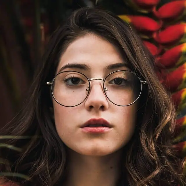 young woman wearing round eyeglasses
